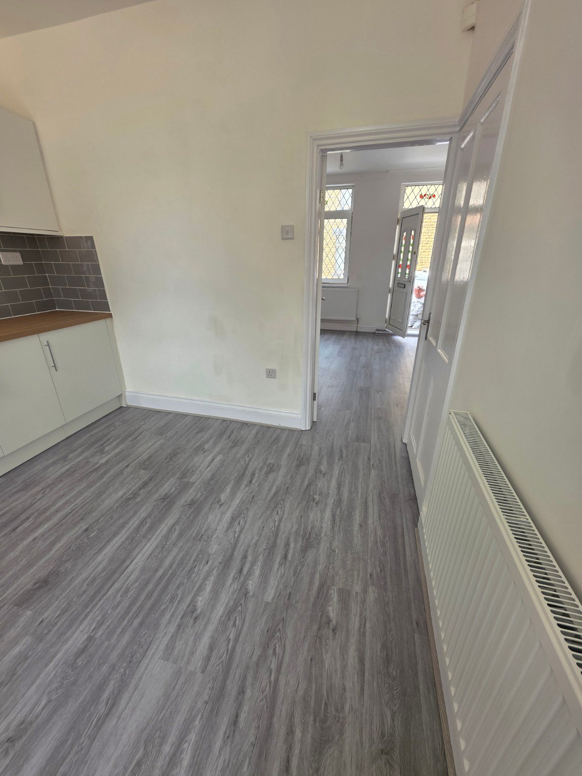 After - SPC Flooring Installation – Kitchen & Living Room project photo