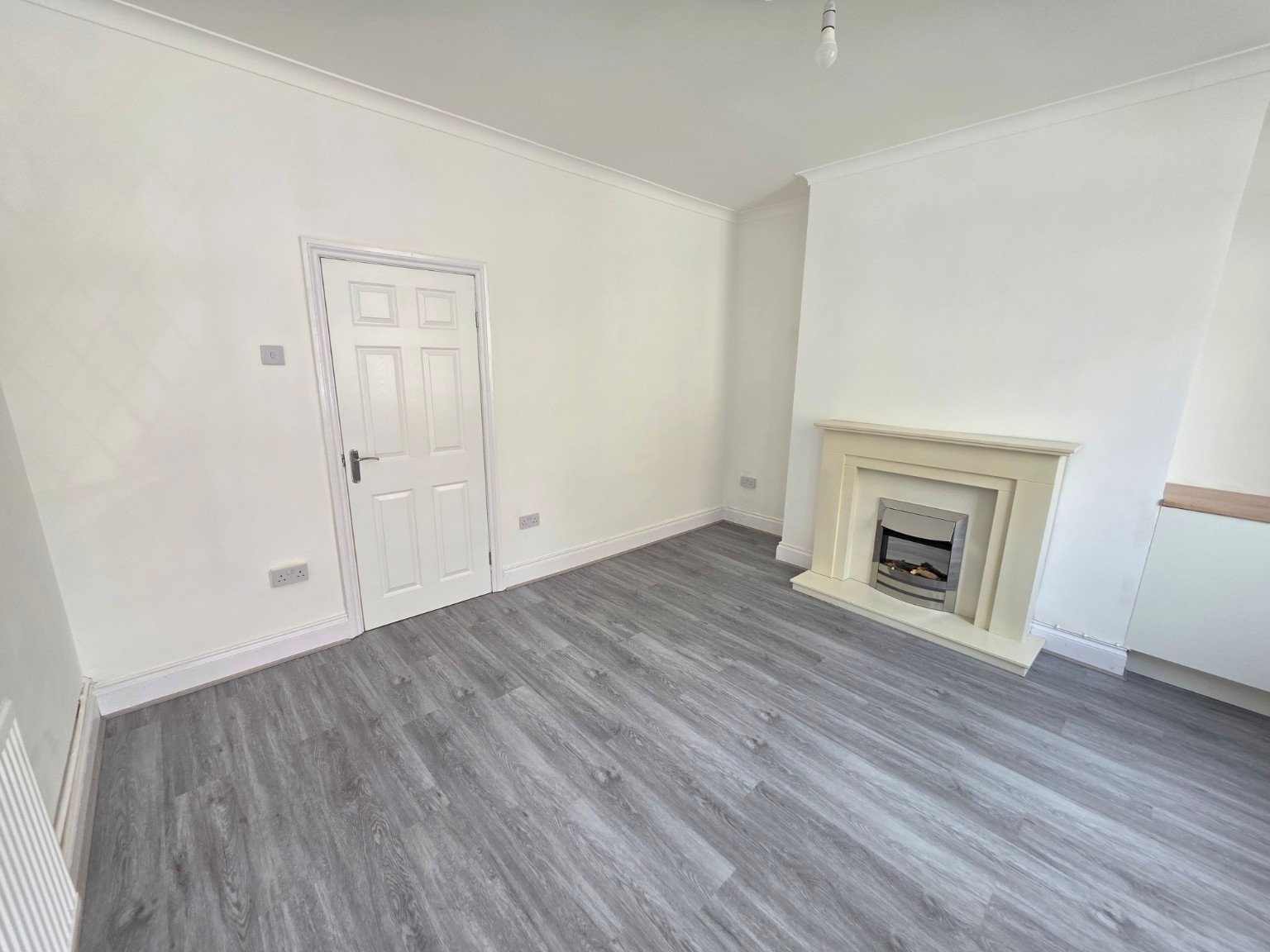 Completed grey SPC flooring in a living room
